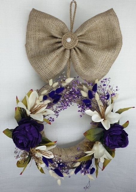 Üstten fiyonklu arajmanlı kapı süsü